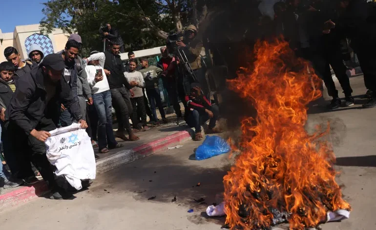 Palestinians burn ‘humiliating’ shirts after release from Israeli prisons
